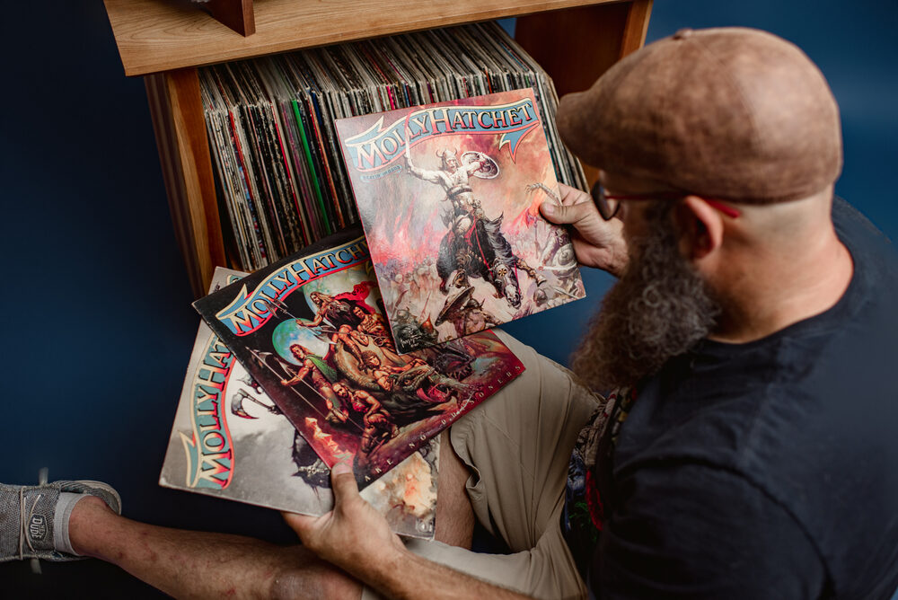 Flipping through a crate of records, admiring an album cover